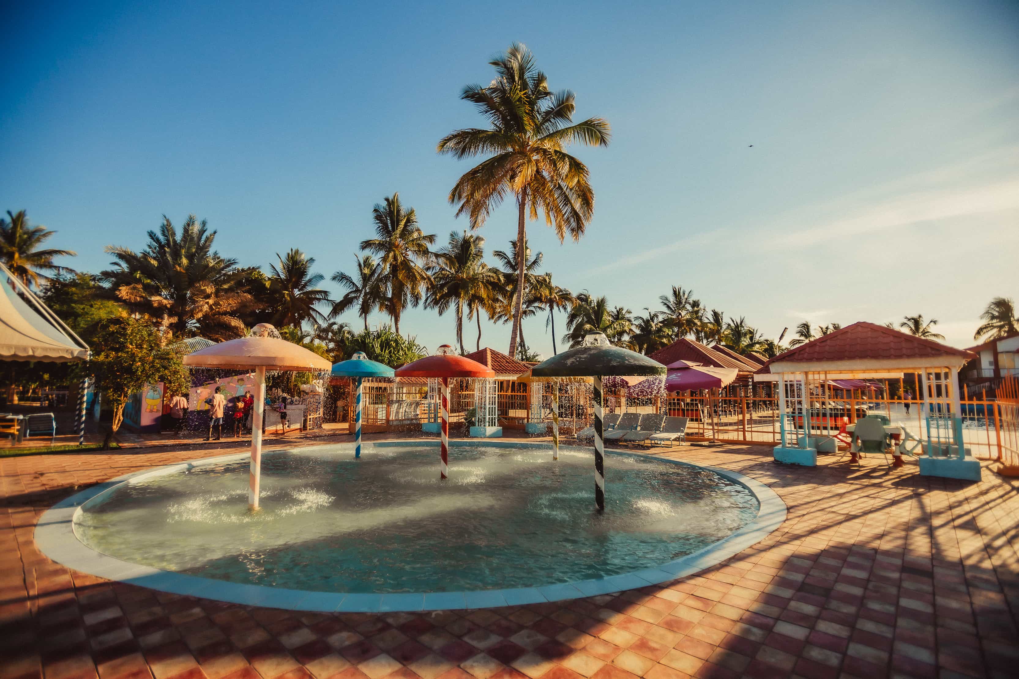 small pool with umbrella fountains