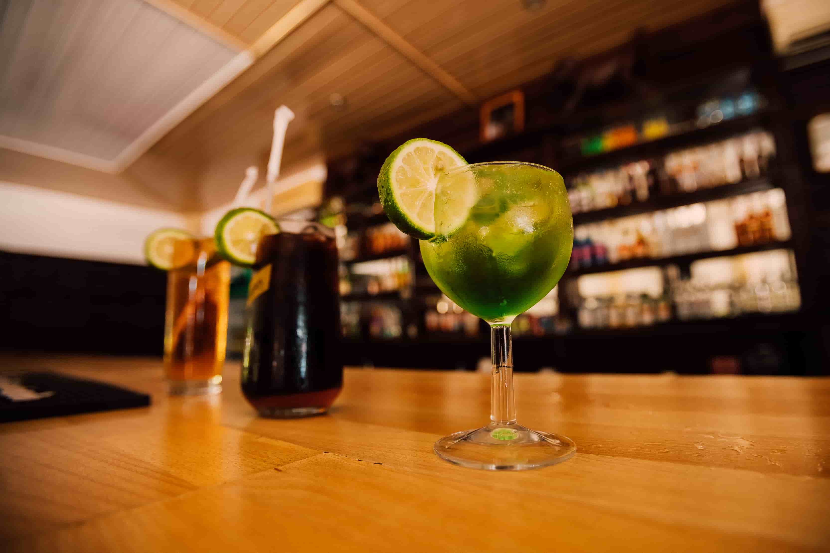 3 cocktails on bar table