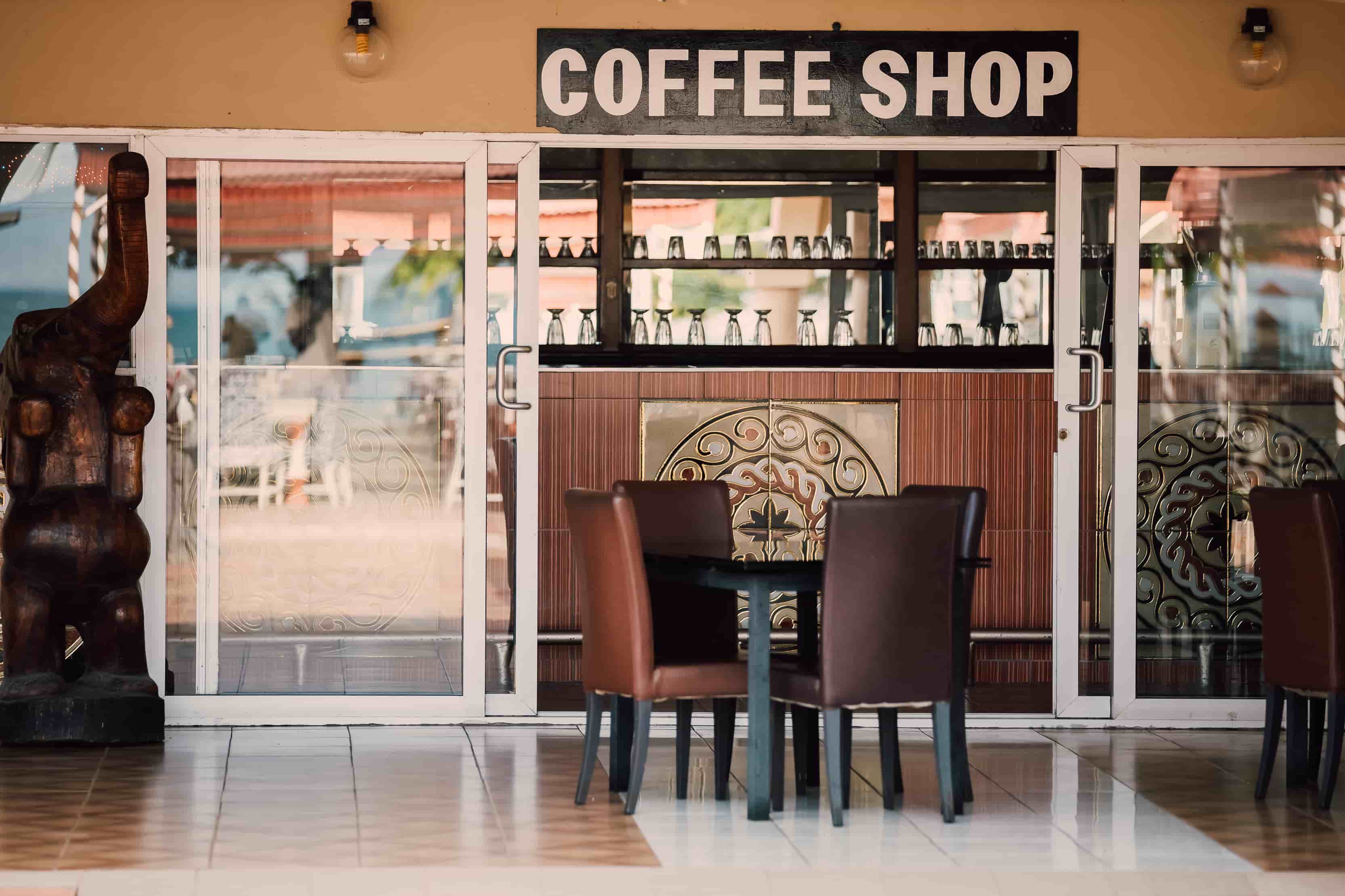 front view of coffee shop with sign