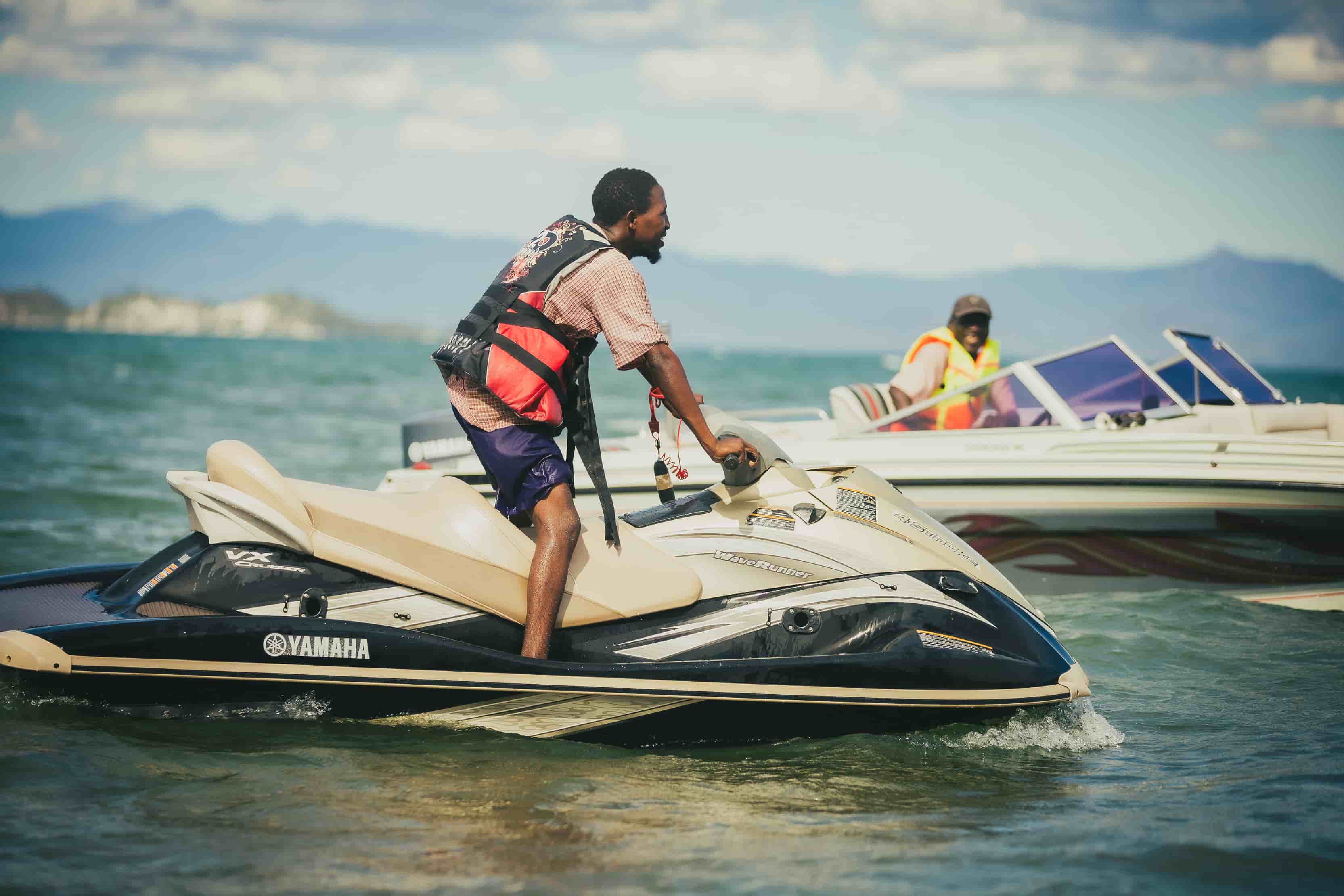 close up of jetski and boat in a stand still on the lake