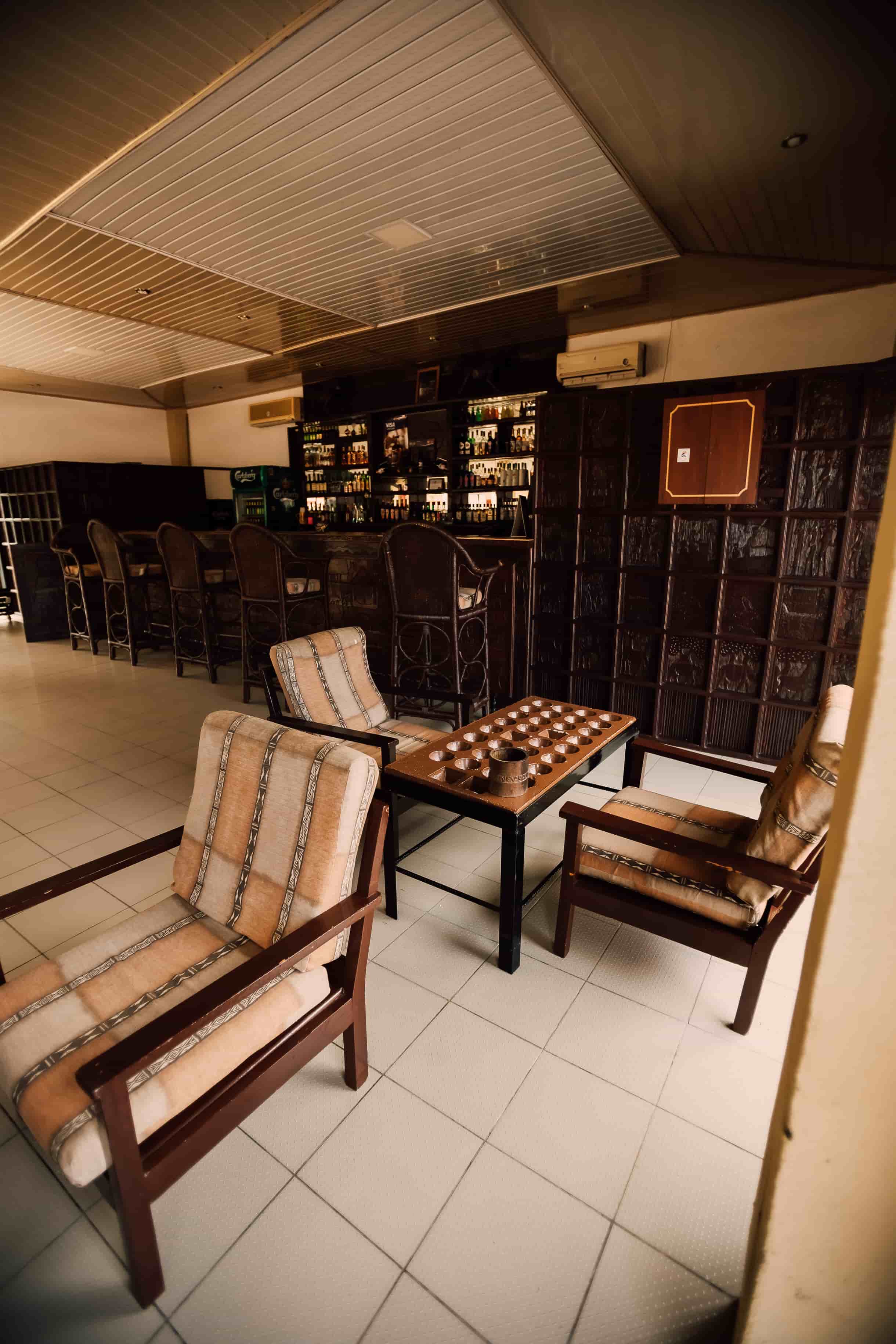 inside view of bar from right side with a view of bao table and chairs