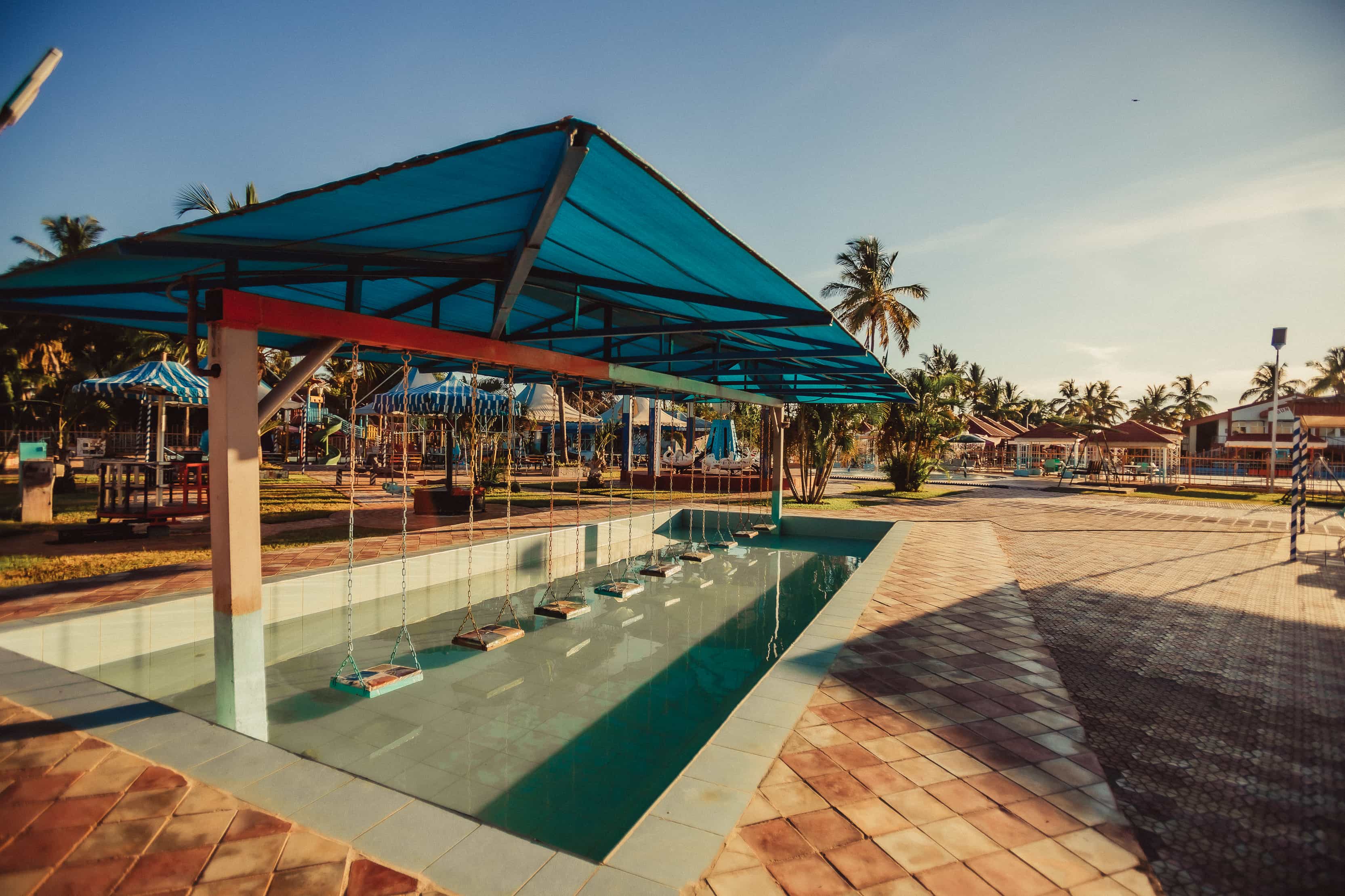 Swings in the shallow children's pool at Fifi Water World