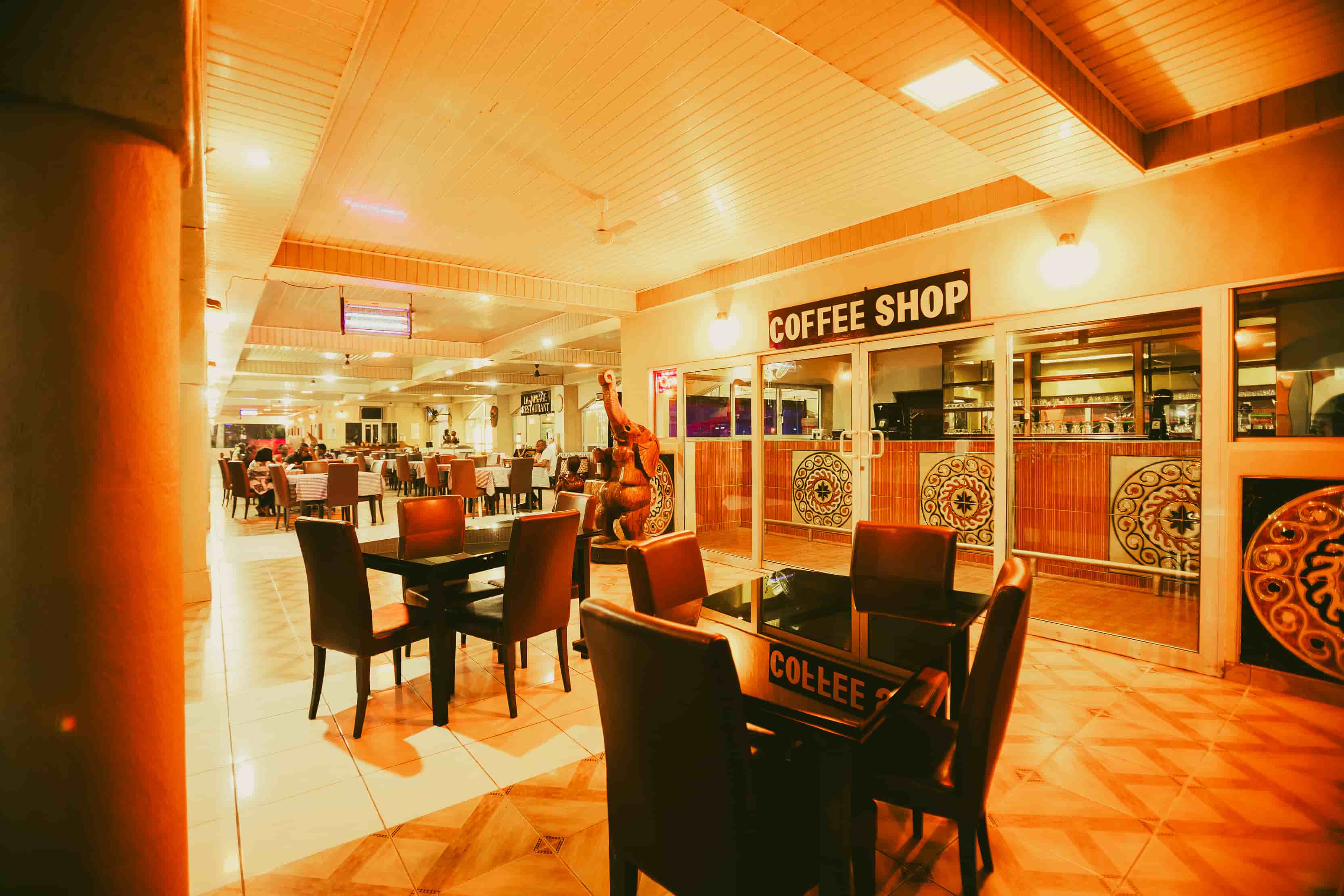 outside view coffee shop with seating at night