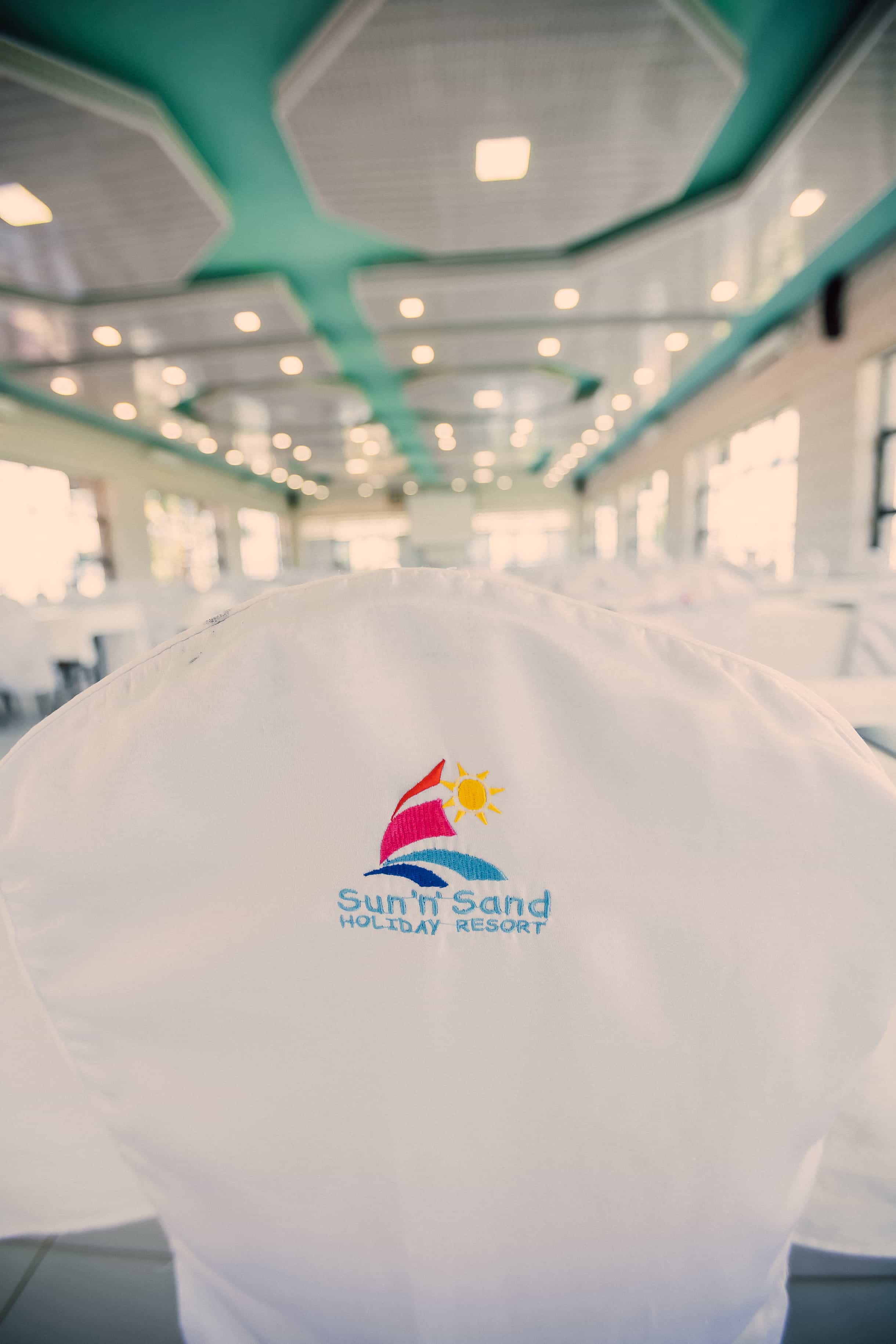 Chair cover with Sun 'n' Sand logo